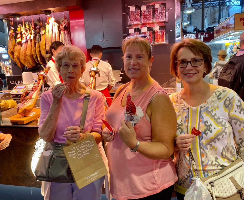 David's daughters and their mother sampling the ham in Spain.